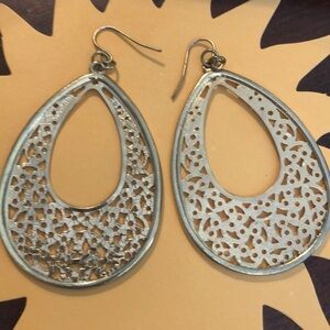 Large dangling gold tone earrings